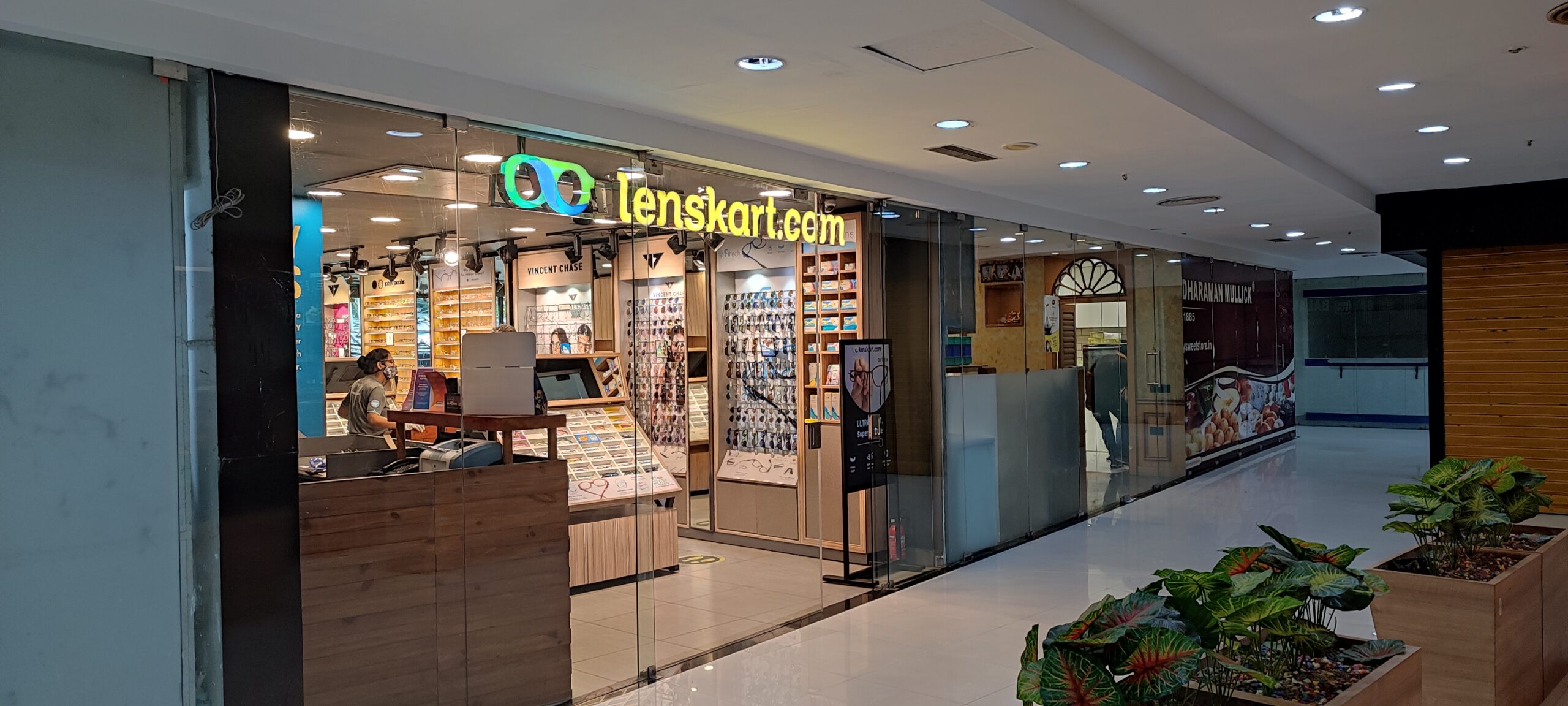 This picture shows an empty, unfinished retail space, highlighting a bare-shell unit ready for a new tenant. It represents an opportunity in commercial real estate for a business to implement its own unique design. The process of choosing a retail space like this involves considering the brand's vision and fit-out requirements. The fact that it is situated in a sought-after prime retail locations such as Salt Lake Sector V underscores its potential for a new business to thrive and build its brand potential from the ground up